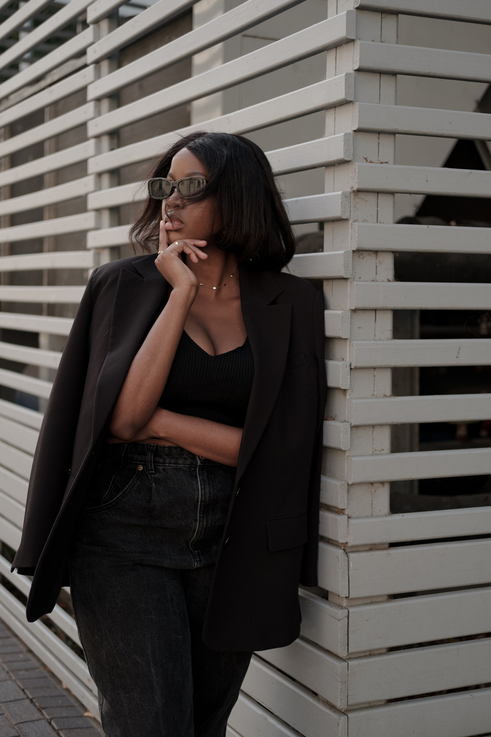 Woman in Black Outfit in the City